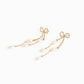 Long Bow Pearl Deco Drop Earrings: Gold