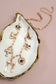 CHARM NECKLACE-PORCELAIN FLORAL BOW CROSS HEART | GOLD