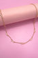 CUTOUT BOW STATION NECKLACE